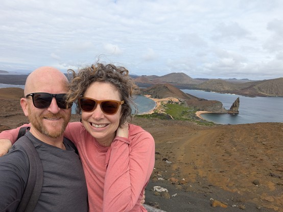 Sally struggling to keep her hair under control in the wind at the top of Isla Bartolomé.