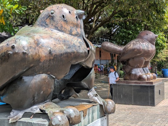 Two Botero sculptures of birds.
