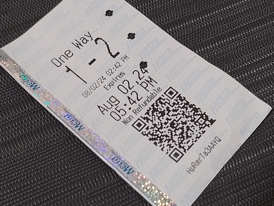 A paper Metra ticket. Not compatible with the Ventra rail and bus tickets.
