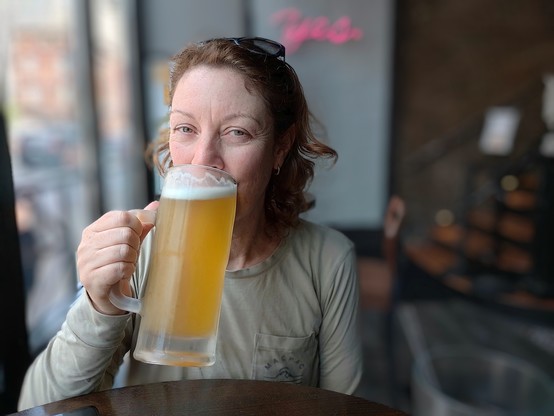 Sally keeping hydrated. 22oz beer for US$7 in Hopsmith.