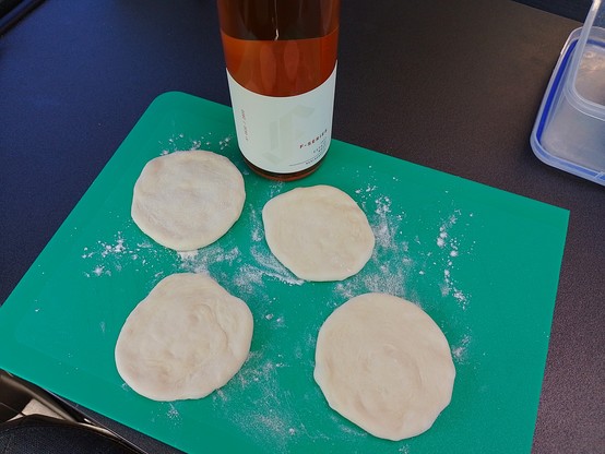 Tortilla prep. Note the rolling pin wine bottle.