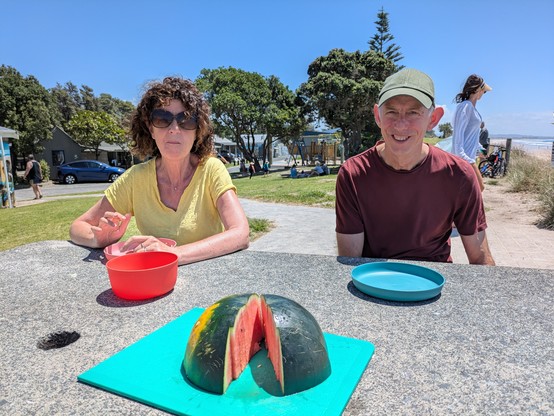 Ally and John with watermelon at Waipu Cove