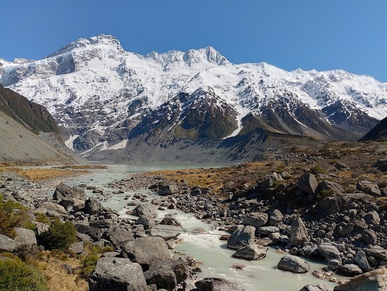 Mt Sefton on the left straddling the range that divides Canterbury and the West Coast. Hooker River in the foreground.