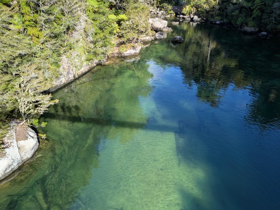 Our silhouette crossing a swing bridge.
