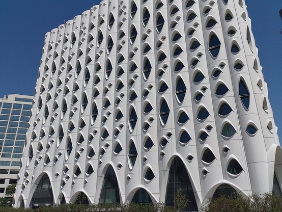 I don't know what this building is but it was near the Civic Centre Park. (edit: it's a new hotel designed to look like the bark of an aspen tree)
