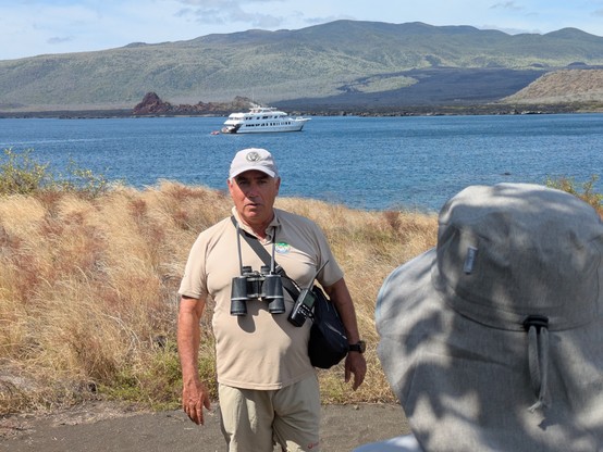 Roberto with our boat in the background. You can't see them but he has sea lion bite marks up his arm from earlier in the year when he tried to remove a hook from one's flipper.