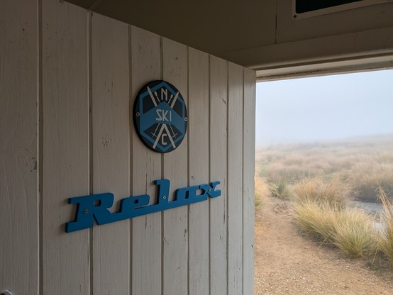 View out the door of the Relax ski hut at the top of Mt Robert
