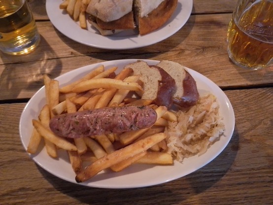 Rabbit and rattlesnake sausage with sauerkraut, fries and pretzel bread.