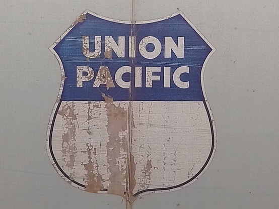A Union Pacific logo on the side of a freight train.