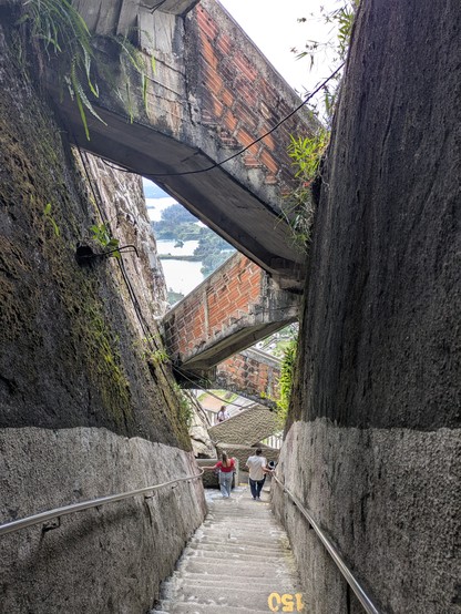 There are separate stairs for up and down traffic.  They follow a crack in the rock.